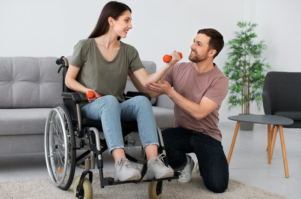 iBCare support worker supporting a client with mobility exercises at home